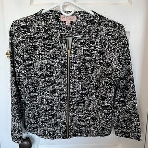 Black and White Blazer with shoulder pads. Very flattering! Only worn once